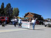 A thumb nail view of Grand Lake, Colorado during Constitution Week in September looking at the Constitution Week Banner opening this years parade; click here to open a window with a larger picture.
